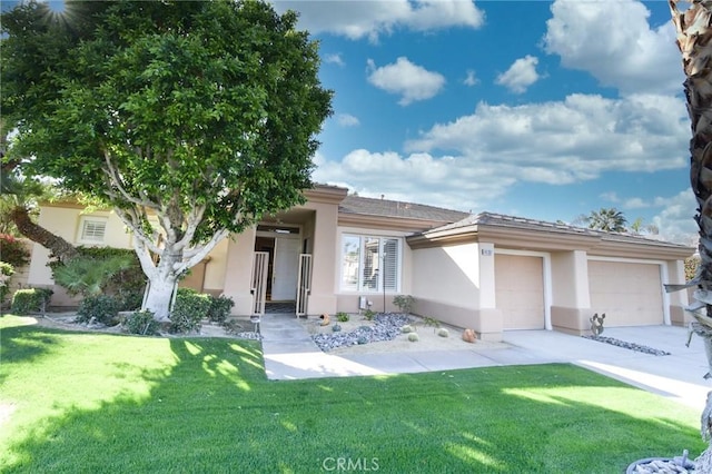 prairie-style house with a garage, driveway, a front lawn, and stucco siding