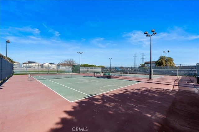 view of sport court with fence