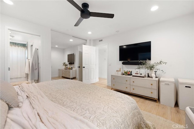 bedroom with light wood-style floors, ceiling fan, visible vents, and recessed lighting