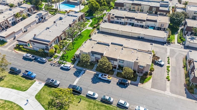 birds eye view of property with a residential view