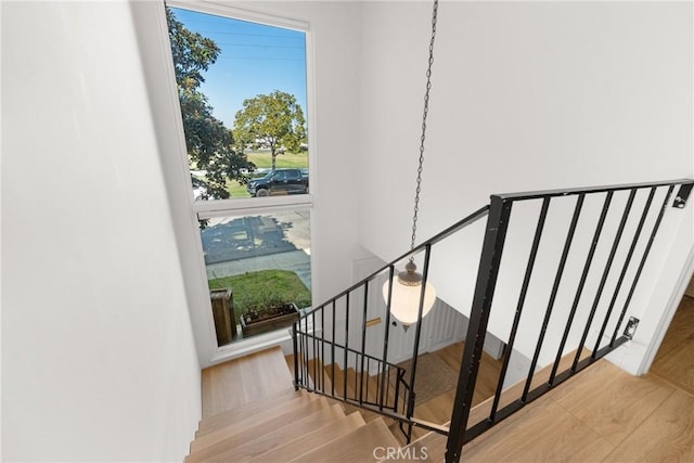 stairs with wood finished floors