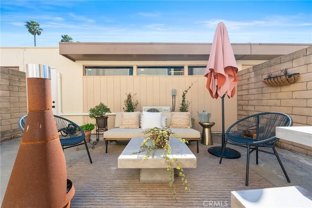 view of patio / terrace with fence and an outdoor hangout area