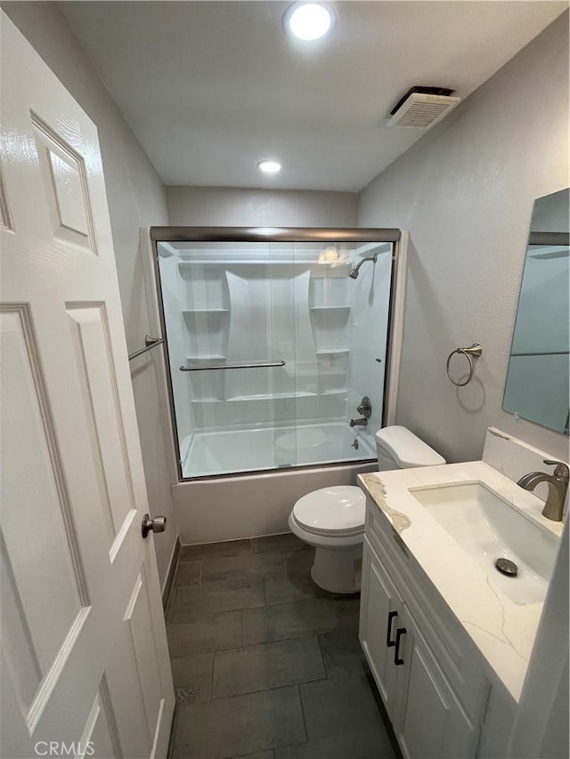 full bathroom featuring visible vents, toilet, combined bath / shower with glass door, vanity, and recessed lighting