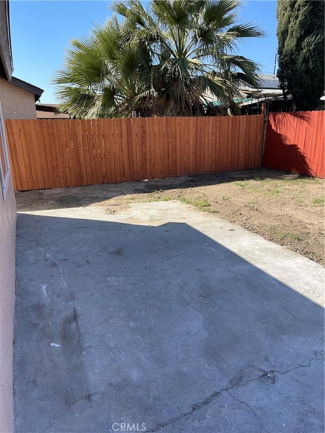 view of yard featuring a fenced backyard and a patio