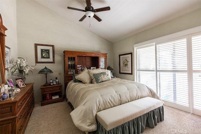 bedroom with lofted ceiling, light colored carpet, and ceiling fan