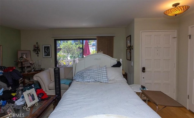 bedroom with wood finished floors