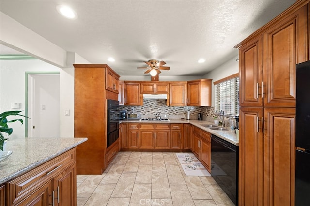 kitchen featuring a sink, a ceiling fan, backsplash, dishwasher, and brown cabinetry