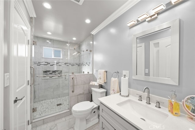 bathroom featuring a stall shower, toilet, ornamental molding, marble finish floor, and vanity