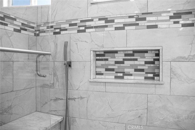 interior space with a tile shower