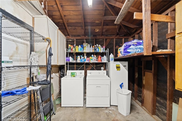 laundry room with separate washer and dryer and cabinet space