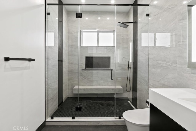 full bath with toilet, a shower stall, and vanity