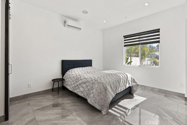 bedroom featuring baseboards and a wall mounted air conditioner