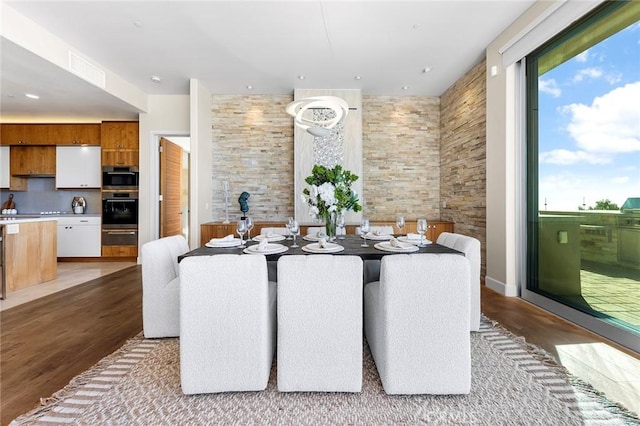 dining space with light wood-type flooring