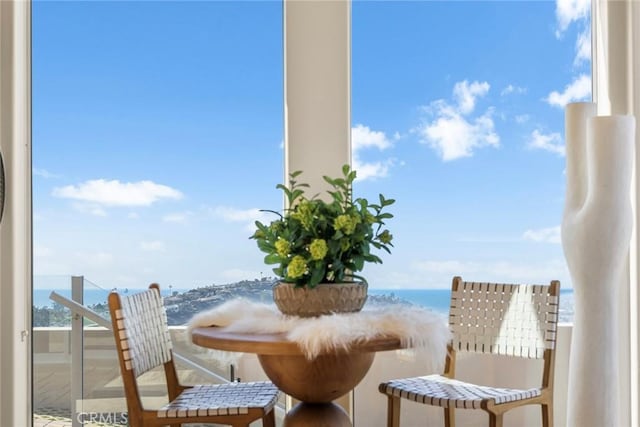 balcony featuring a water view