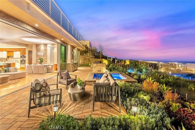 outdoor pool featuring a patio, area for grilling, a fenced backyard, and an outdoor living space