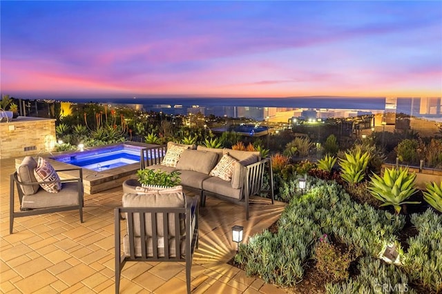 view of patio featuring an outdoor living space and an in ground hot tub