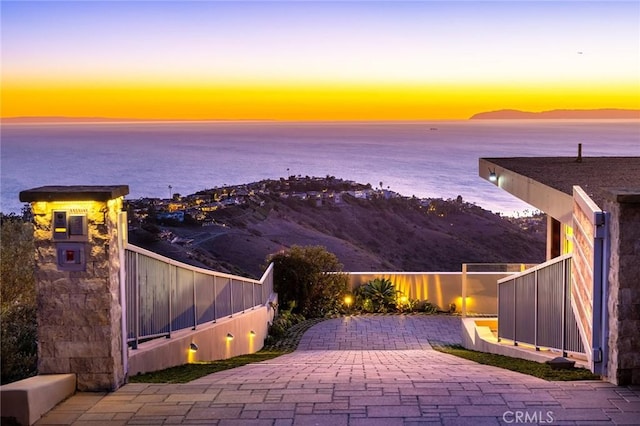 water view featuring a mountain view and fence