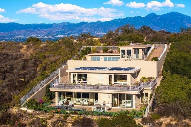 3355 Alta Laguna Blvd, Laguna Beach, CA 92651 - rear view of house featuring a mountain view, an outdoor pool, and stone siding