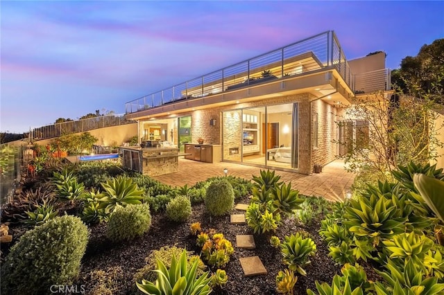 3355 Alta Laguna Blvd, Laguna Beach, CA 92651 - rear view of house featuring area for grilling, a patio area, brick siding, and a balcony
