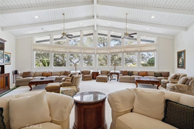 interior space featuring ceiling fan, high vaulted ceiling, and beam ceiling