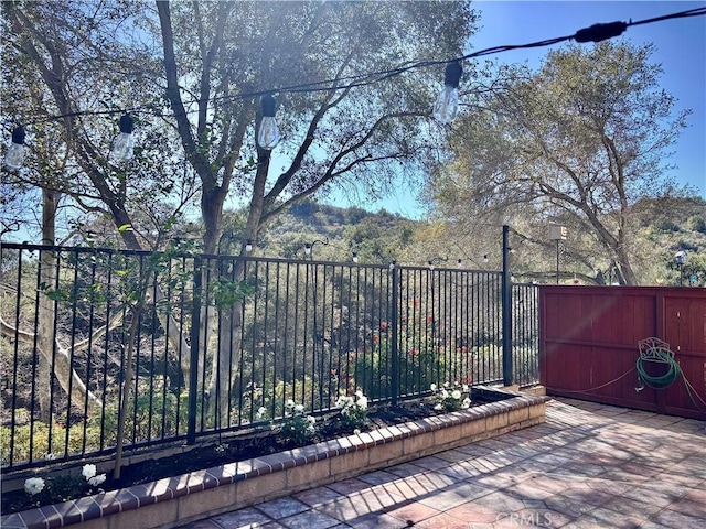 view of gate featuring fence