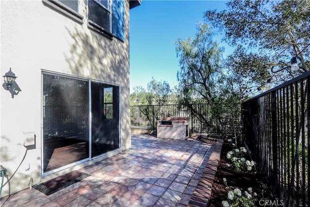 view of patio featuring fence