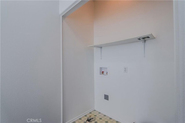 laundry area featuring light floors, hookup for a washing machine, and laundry area