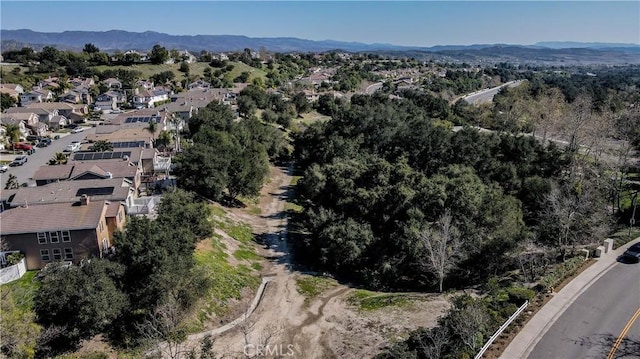 birds eye view of property with a residential view and a mountain view