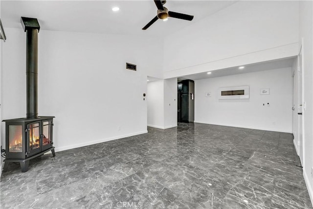 22809 Hilton Head Dr Unit 14, Diamond Bar, CA 91765 - unfurnished living room featuring ceiling fan, a wood stove, recessed lighting, marble finish floors, and high vaulted ceiling
