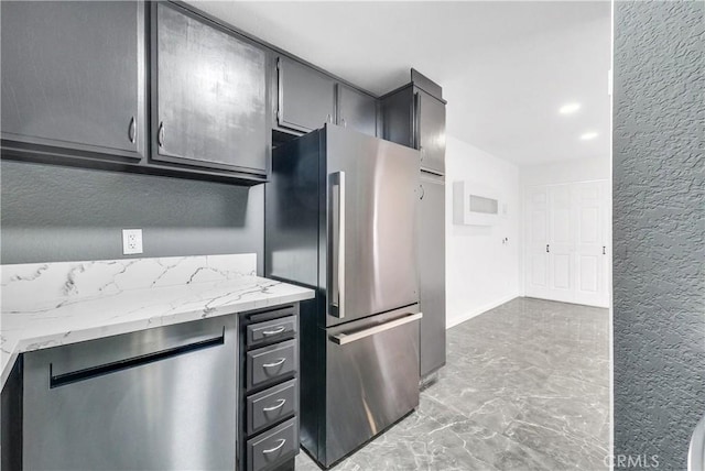 22809 Hilton Head Dr Unit 14, Diamond Bar, CA 91765 - kitchen featuring freestanding refrigerator, light marble finish flooring, a textured wall, and light stone counters