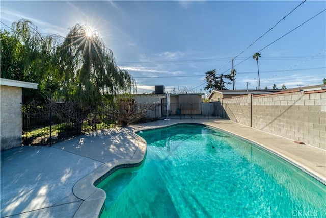 view of swimming pool featuring a fenced in pool, a patio area, and a fenced backyard