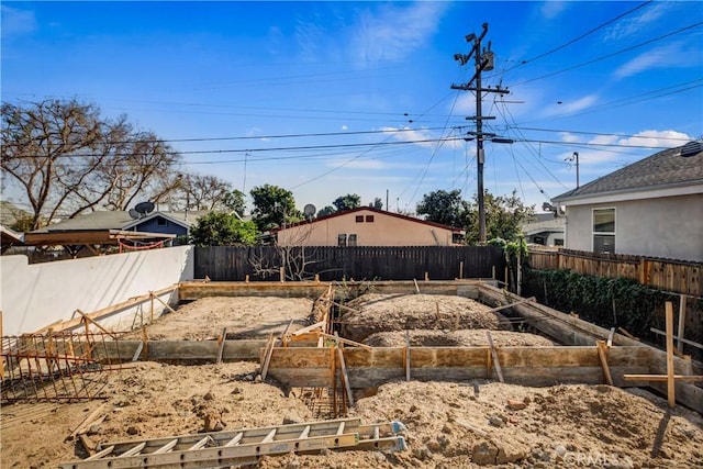 view of yard with a fenced backyard and a vegetable garden