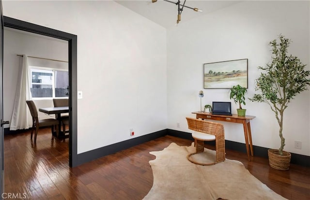 office featuring baseboards and dark wood-type flooring