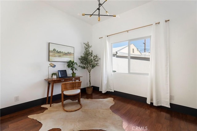 office featuring dark wood-style floors, baseboards, and a notable chandelier