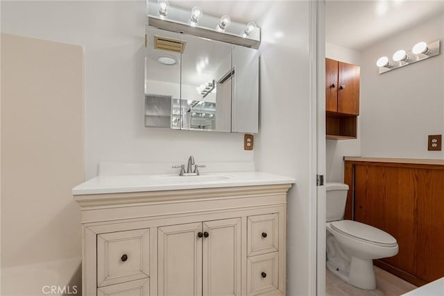 full bathroom with vanity and toilet