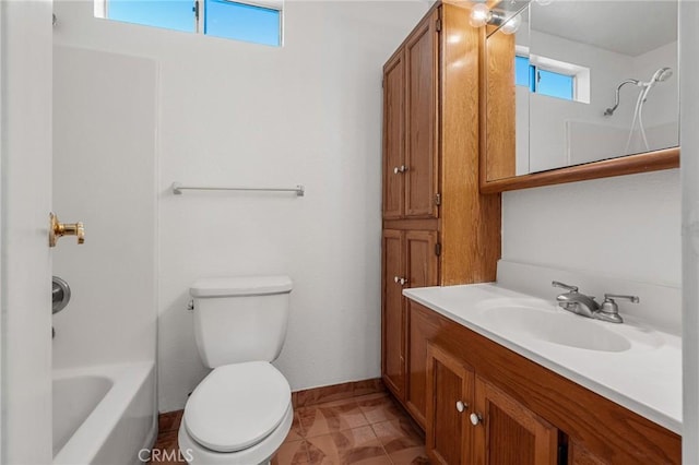 full bath with baseboards, vanity, toilet, and bathing tub / shower combination