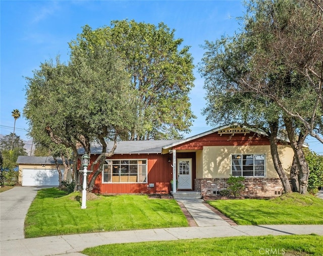 ranch-style home with a front lawn, board and batten siding, and brick siding