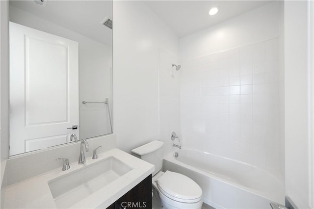 bathroom with visible vents, bathing tub / shower combination, toilet, vanity, and recessed lighting