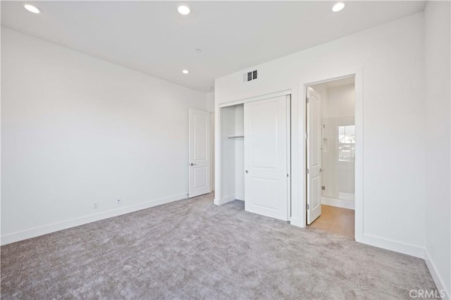 unfurnished bedroom with carpet floors, baseboards, visible vents, and recessed lighting