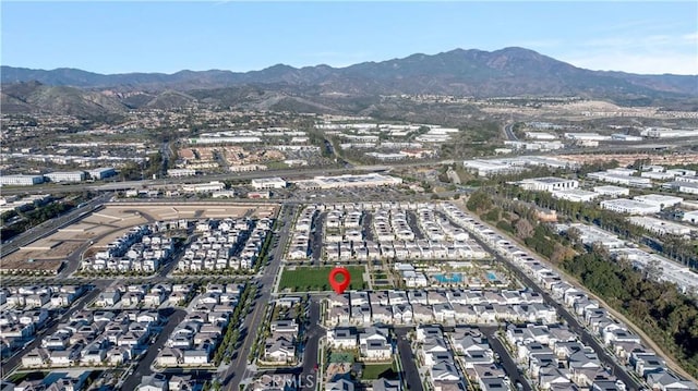 birds eye view of property with a mountain view