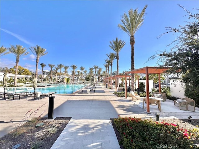 pool featuring a patio and fence