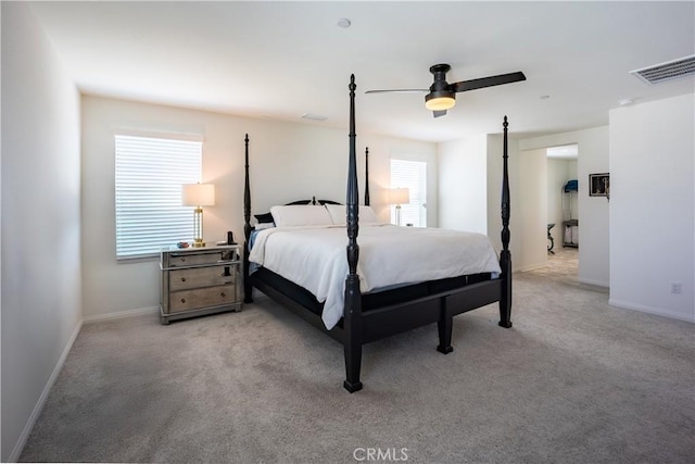 bedroom featuring light carpet, visible vents, and baseboards