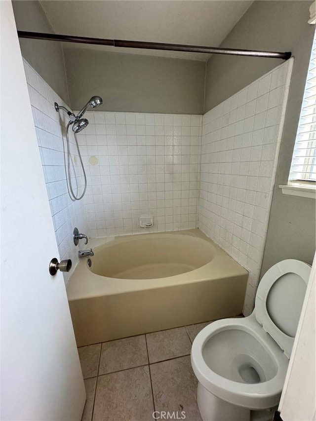 full bath with toilet, tub / shower combination, and tile patterned floors