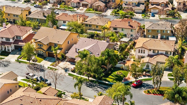 birds eye view of property with a residential view