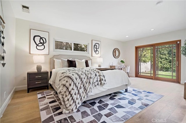 bedroom featuring light wood-style flooring, recessed lighting, visible vents, and access to exterior