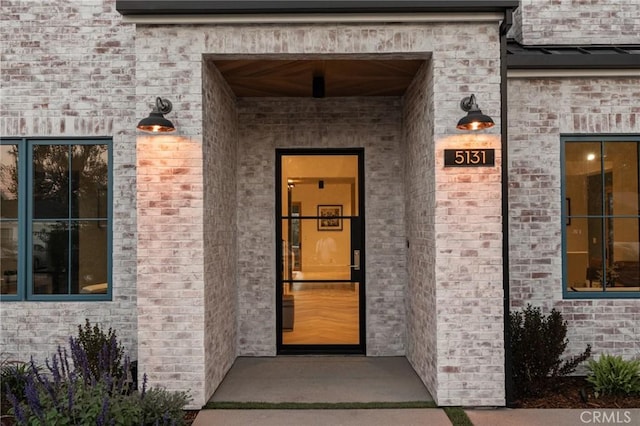 entrance to property with brick siding