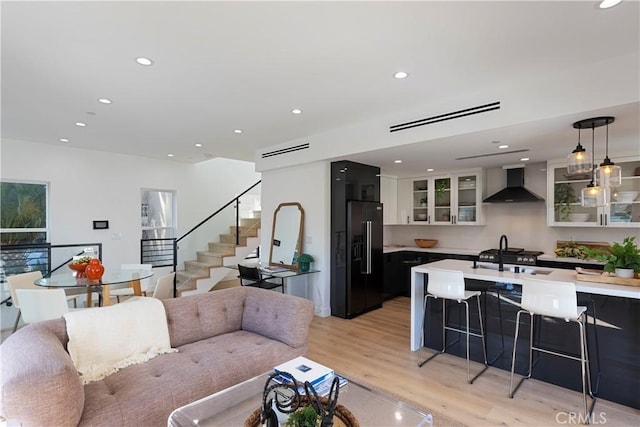 1903 N Stoke Ln, Los Angeles, CA 90068 - living area with light wood-style flooring, recessed lighting, and stairs