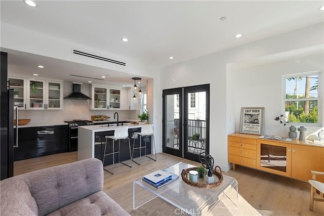 1903 N Stoke Ln, Los Angeles, CA 90068 - living area featuring light wood-style flooring, recessed lighting, and french doors