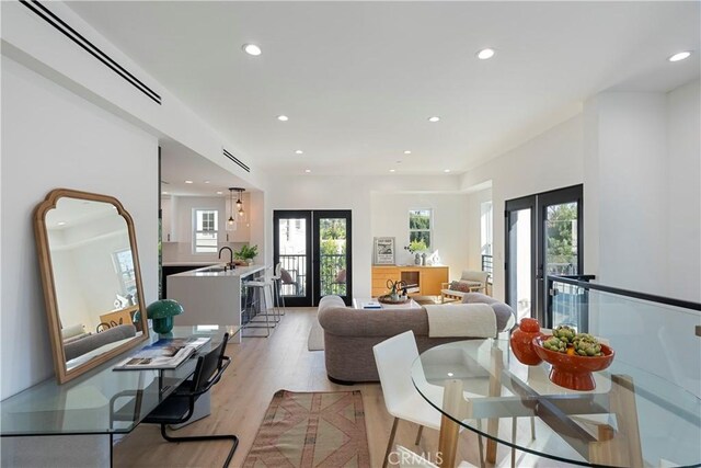 1903 N Stoke Ln, Los Angeles, CA 90068 - living area featuring recessed lighting, light wood-type flooring, and french doors