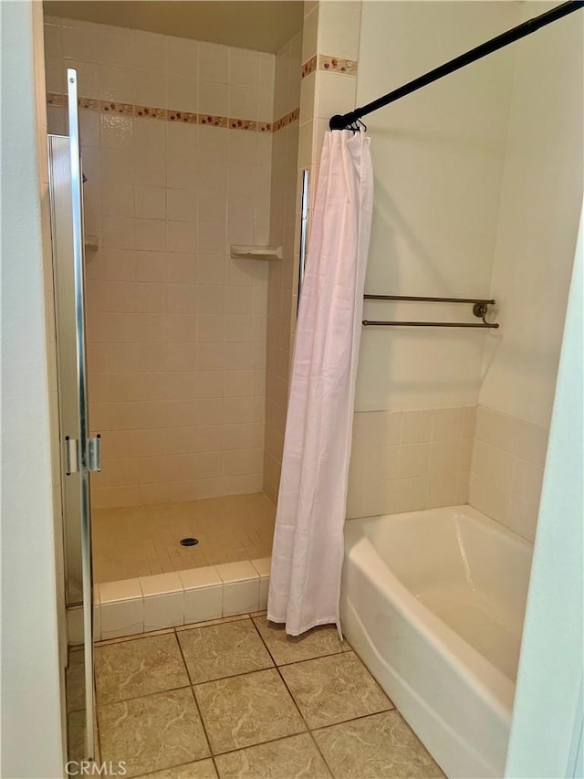 bathroom featuring a shower stall and tile patterned floors